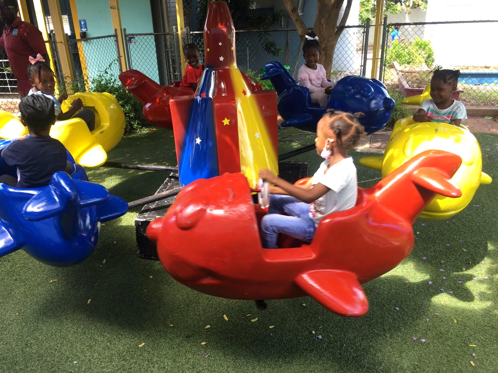 Toddler on the WildRides aeroplane ride